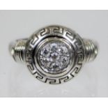 An 18ct white gold diamond Versace style ring 6g