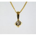 A 9ct gold necklace & pendant set with small diamo