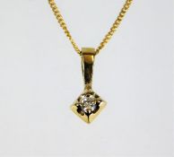 A 9ct gold necklace & pendant set with small diamo