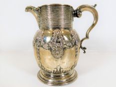 A George II silver ale jug, later decorated with c