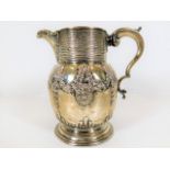 A George II silver ale jug, later decorated with c