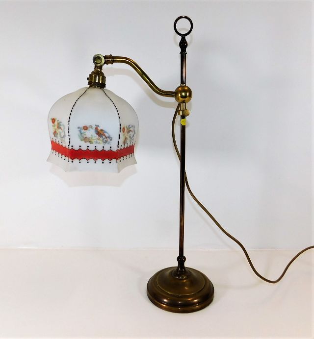 An early 20thC. brass rise & fall electric lamp wi