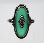 A 9ct gold & silver ring set with jade & marcasite