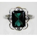 A 9ct white gold ring set with tourmaline & diamon