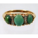 A yellow metal ring, tests as 18ct gold, set with natural turquoise & diamonds 3.3g size I/J