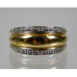 A 9ct gold ring set with two rows of diamonds 2.9g