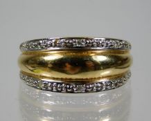 A 9ct gold ring set with two rows of diamonds 2.9g