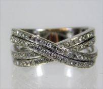 A 14ct white gold crossover ring set with 0.5ct di