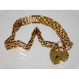 A 15ct gold bracelet 13.5g with 9ct gold padlock c