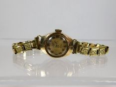 A 9ct gold cased ladies wristwatch with plated str