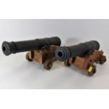 A pair of large oak mounted desk cannons
