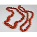 Two c.1920's carnelian necklaces 143.4g