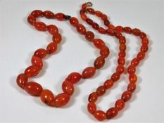 Two c.1920's carnelian necklaces 143.4g