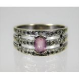 A 9ct white gold ring set with approx. 0.3ct diamond & pink sapphire 4.7g size Q