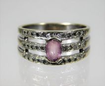 A 9ct white gold ring set with approx. 0.3ct diamond & pink sapphire 4.7g size Q