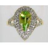 An 18ct diamond & peridot ring 4.7g size N