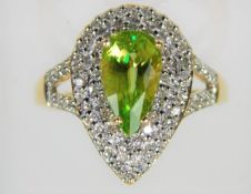 An 18ct diamond & peridot ring 4.7g size N