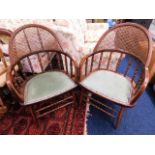 A pair of hoop back armchairs with cane backs