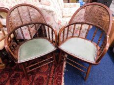 A pair of hoop back armchairs with cane backs