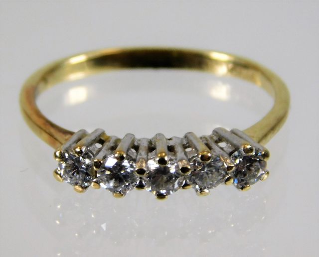 A 14ct gold ring set with five diamonds, approx. 0.35ct 1.9g size L/M