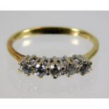 A 14ct gold ring set with five diamonds, approx. 0.35ct 1.9g size L/M