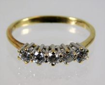A 14ct gold ring set with five diamonds, approx. 0.35ct 1.9g size L/M