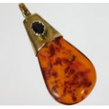 A yellow metal & sapphire mounted amber pendant 2.