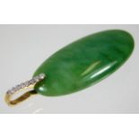 A 9ct mounted jade pendant set with approx. 0.15ct