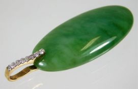 A 9ct mounted jade pendant set with approx. 0.15ct