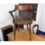 A c.1900 leather seated oak stick back desk chair