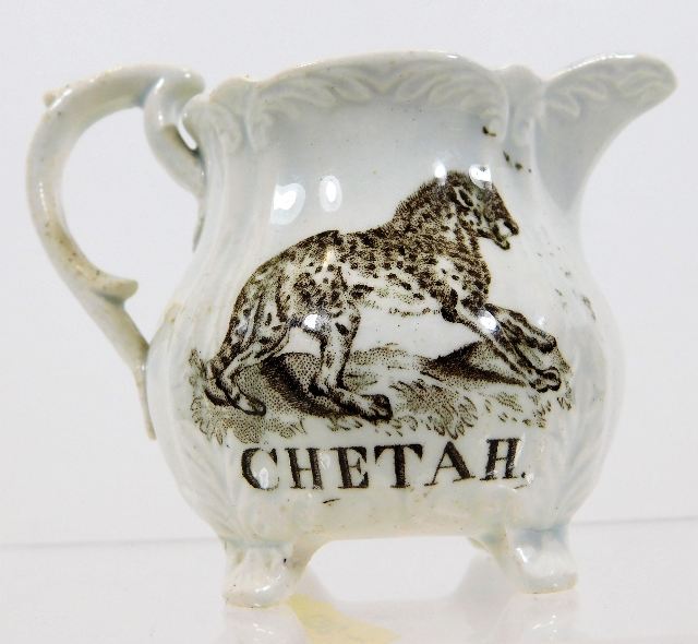 A small 19thC. porcelain cream jug with "Chetah &