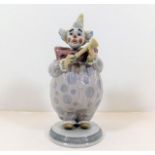 A Lladro clown figurine with horn pattern no. 6938