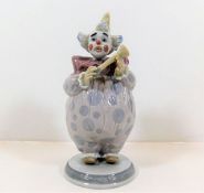 A Lladro clown figurine with horn pattern no. 6938