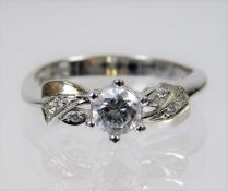 A 14ct white gold ring set with white stones 2.7g