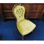 A Victorian upholstered button back chair