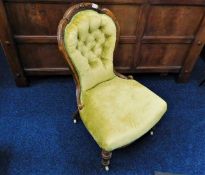 A Victorian upholstered button back chair
