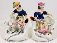 A pair of Staffordshire figurative spills with poo