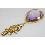 A good 18ct gold pendant with beetle & amethyst pendant decorated with diamonds, the single diamond