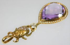 A good 18ct gold pendant with beetle & amethyst pendant decorated with diamonds, the single diamond