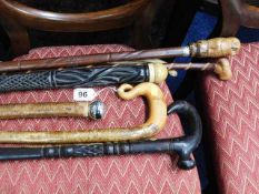 Seven vintage walking canes including carved owl