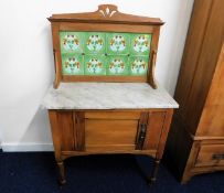 A c.1900 satinwood washstand with marble top & til