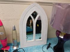 A gothic style decorative mirror