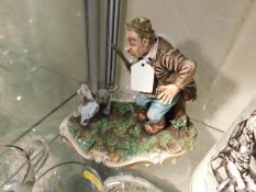 A Capodimonte figure group of man & dog