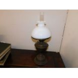 A brass oil lamp & shade