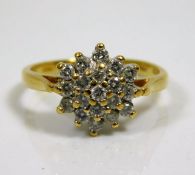 An 18ct gold diamond cluster ring 3.5g