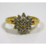 An 18ct gold diamond cluster ring 3.5g