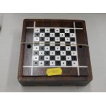 A small rosewood chess set, two pieces missing