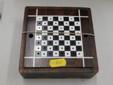 A small rosewood chess set, two pieces missing