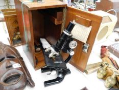 A mahogany cased Hawksley microscope