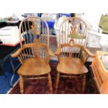 A pair of hoop back armchairs